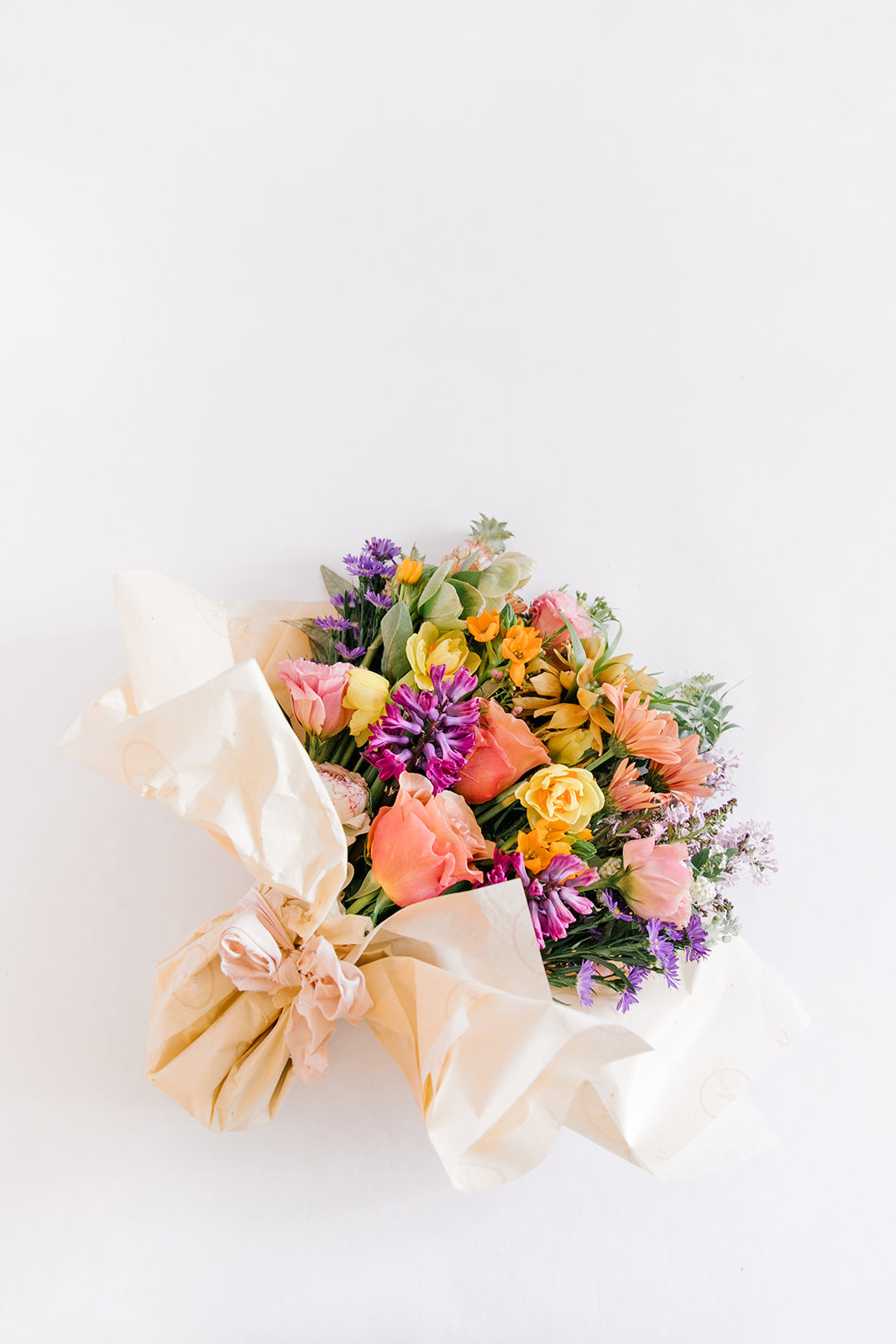 Bouquet of Mixed Flowers Wrapped in Paper